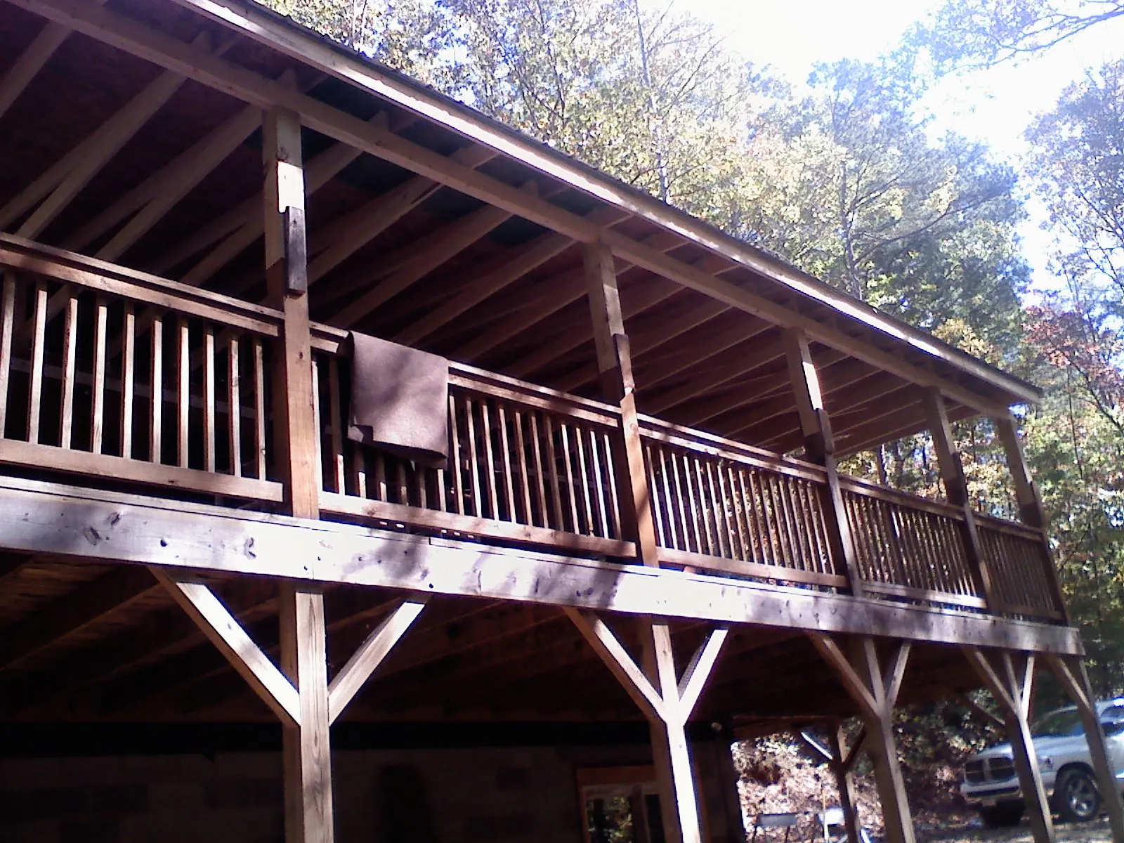 Timber framing under a new elevated porch and deck — Roof Leak Repair in West Kingston by Roofing Brothers